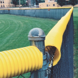 Yellow Poly-cap on a Baseball Fence